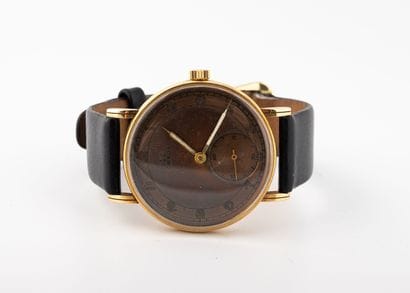 OMEGA
Men's wristwatch in yellow gold (585).
Signed...