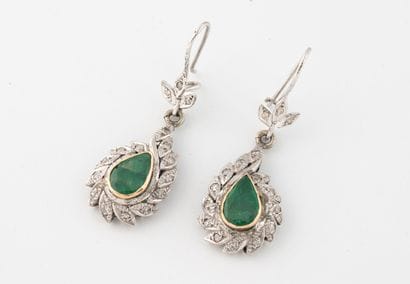 Pair of pear-shaped earrings in white gold...