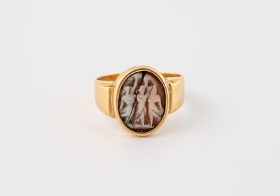Yellow gold (750) ring centered with an oval...