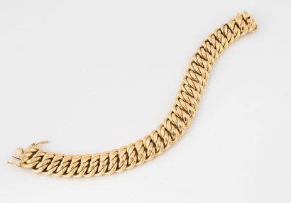 Chased American link bracelet in yellow gold...