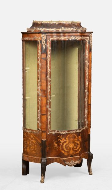 Veneered display cabinet in a curved shape....