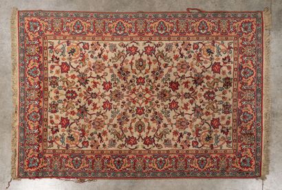 Two polychrome wool rugs with cream fields,...