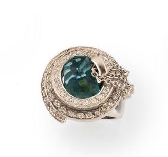 Large white gold (750) ring centered on a...