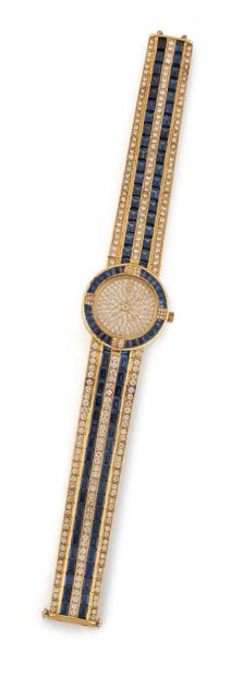 CORUM
Belle montre bracelet en or jaune (750),...
