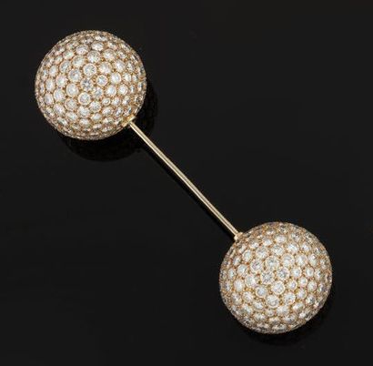 Amusing pin brooch in yellow and white gold...