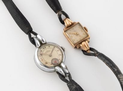 Two ladies' watches with black leather straps:
-...