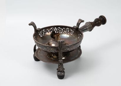 Circular, tripod stove in silver-plated metal...