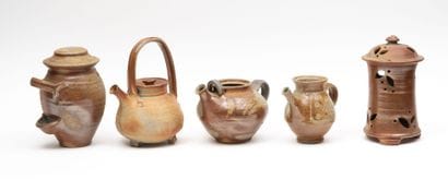 Stoneware lot including:
-A teapot.
-Two...