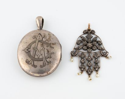 Two silver pendants (min. 800) comprising...