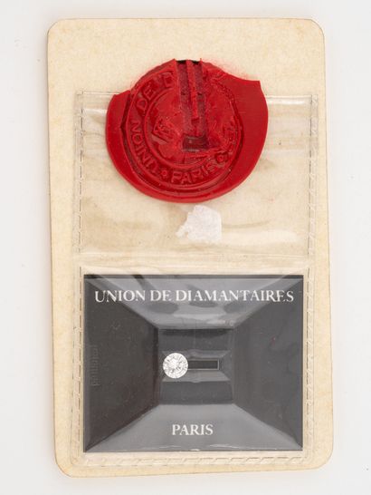 Diamond on paper, brilliant cut, under seal....