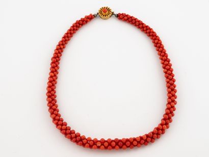 Necklace featuring a braid of small round...