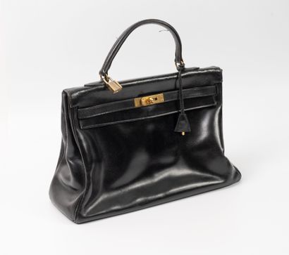 HERMES
35 cm Kelly bag in black box calf.
Inner...