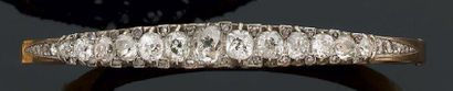 Bracelet rigide, ouvrant, en or jaune et...