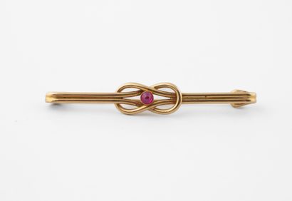Broche noeud en or jaune (750) centré d'un...