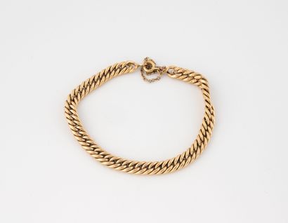 Bracelet gourmette en or jaune (750).
Fermoir...