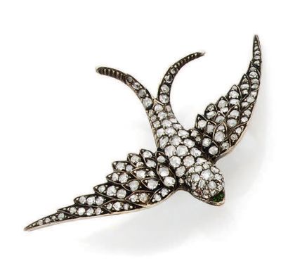 Broche hirondelle en or jaune (750) et argent...