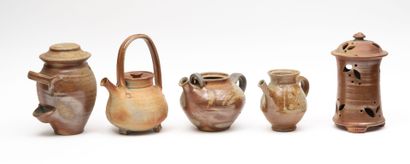 Stoneware lot including:
-A teapot.
-Two...