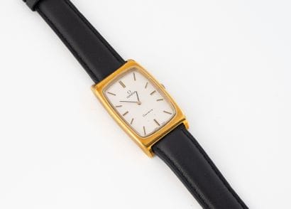 OMEGA 
Men's wristwatch in metal and gilt...