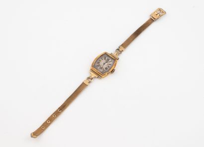 Yellow gold (750) tonneau-case ladies' watch.
White...