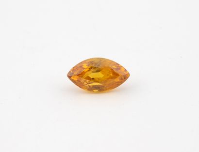 Orange yellow sapphire, navette cut, on paper.
Weight:...