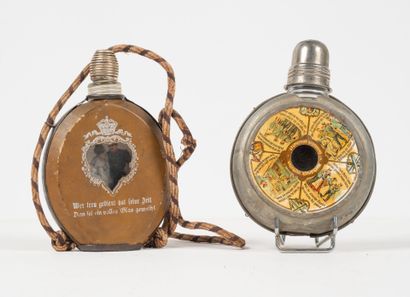 ALLEMAGNE
Two glass reservist flasks, one...