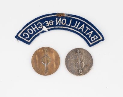 Two 11th Choc badges (D. Ber. numbered) and...