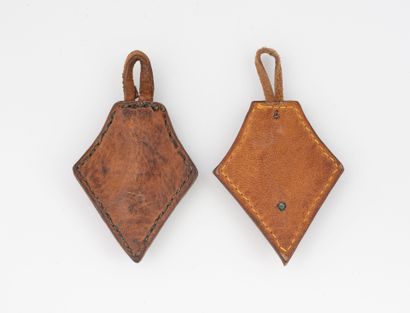 Two leather-mounted insignia (Drago?) of...