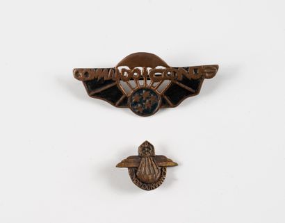 Two Commando Conus badges. A molded and painted...