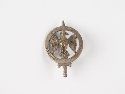 A badge: Commando No. 26. (Local manufac...