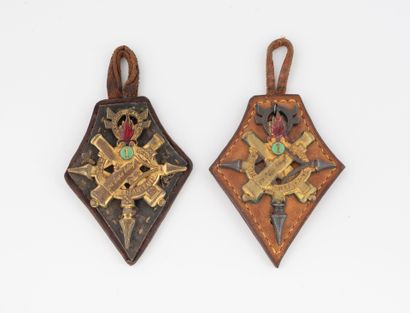 Two leather-mounted insignia (Drago?) of...