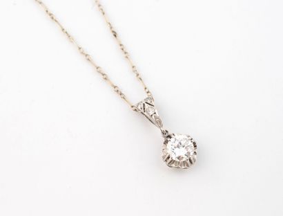 White gold (750) horse chain holding a platinum...
