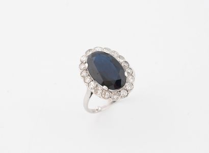 Platinum (850) daisy ring set with an oval...