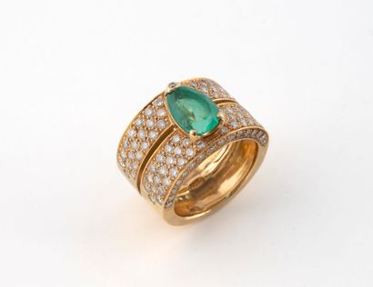 Bague en or jaune (750) à deux bandeaux centré...