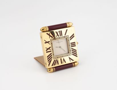 CARTIER
Square-shaped travel clock in gilt...