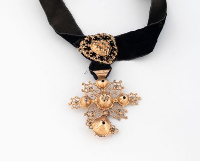 Necklace featuring a black velvet ribbon...