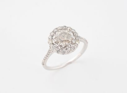 Bague or gris 585 millièmes, ornée d'un diamant...