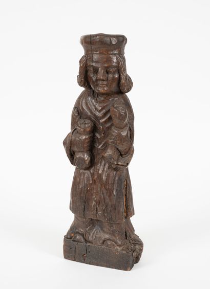 Homme tenant un parchemin roulé et une bourse.
Statue...