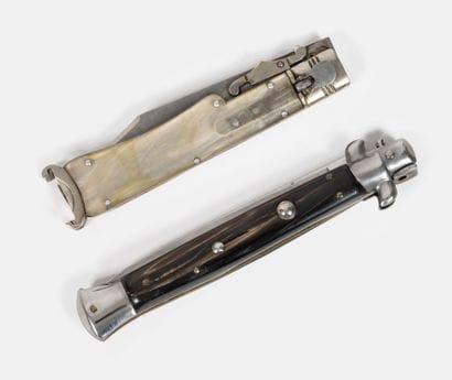 2 locking knives, one marked Toledo, the...