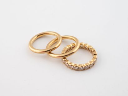 Set of three rings in yellow gold (750),...