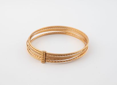 Bracelet semainier en or jaune (750) à motifs...