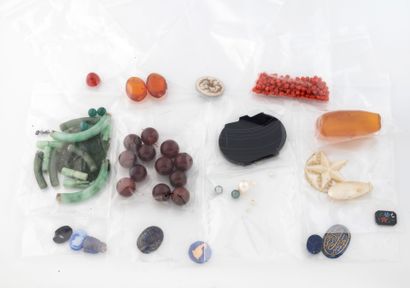 Lot of colored stones in various shapes including...