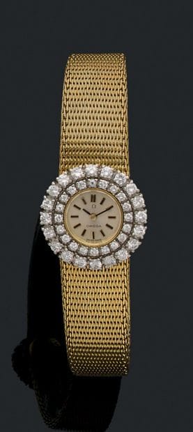 OMEGA
Ladies' wristwatch in yellow gold (750).
Round...