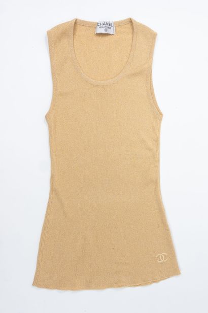 Chanel Boutique. 
Mesh tank top with gold...