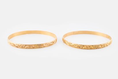 Two yellow gold (750) rigid bracelets with...