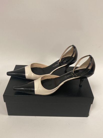 CHANEL
Pair of open pumps with two-tone black...