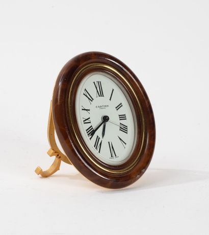 CARTIER
Gilt metal alarm clock on the back.
In...