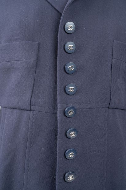 Chanel Boutique.
Navy blue button-down jacket...