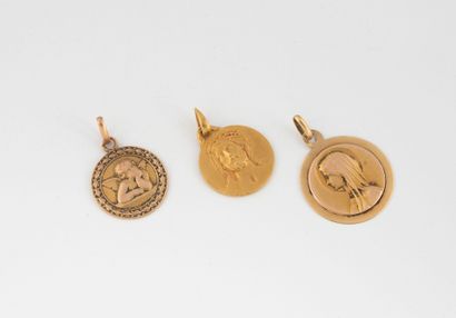 Set of three round religious medals with...