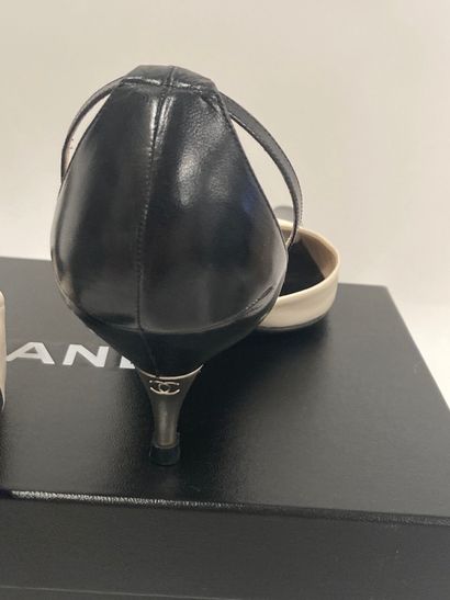 CHANEL
Pair of open pumps with two-tone black...