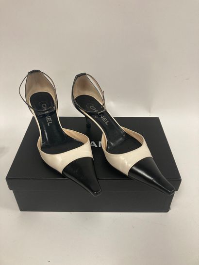 CHANEL
Pair of open pumps with two-tone black...